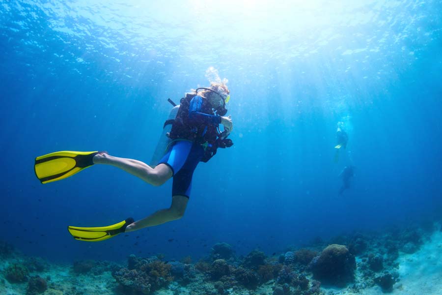 idle scuba diver near the ocean floor