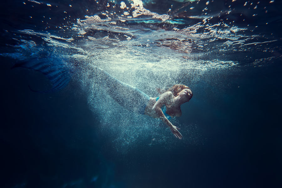 mermaid freediving in the water