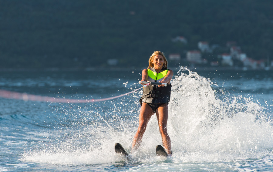 a woman with the perfect water skiing position