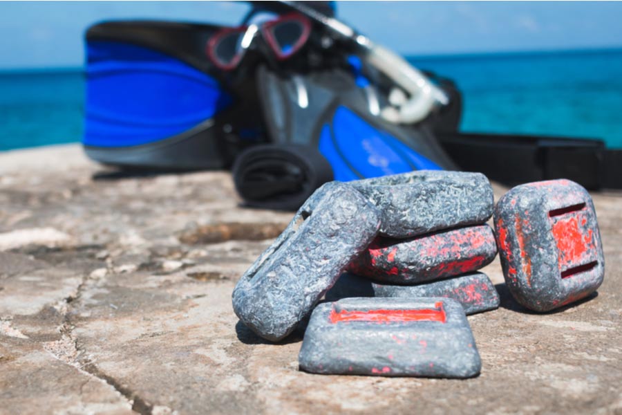 scuba weights on a rock