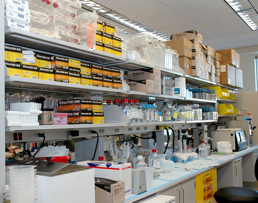 shelves stacked with medical equipment in a clinical research lab